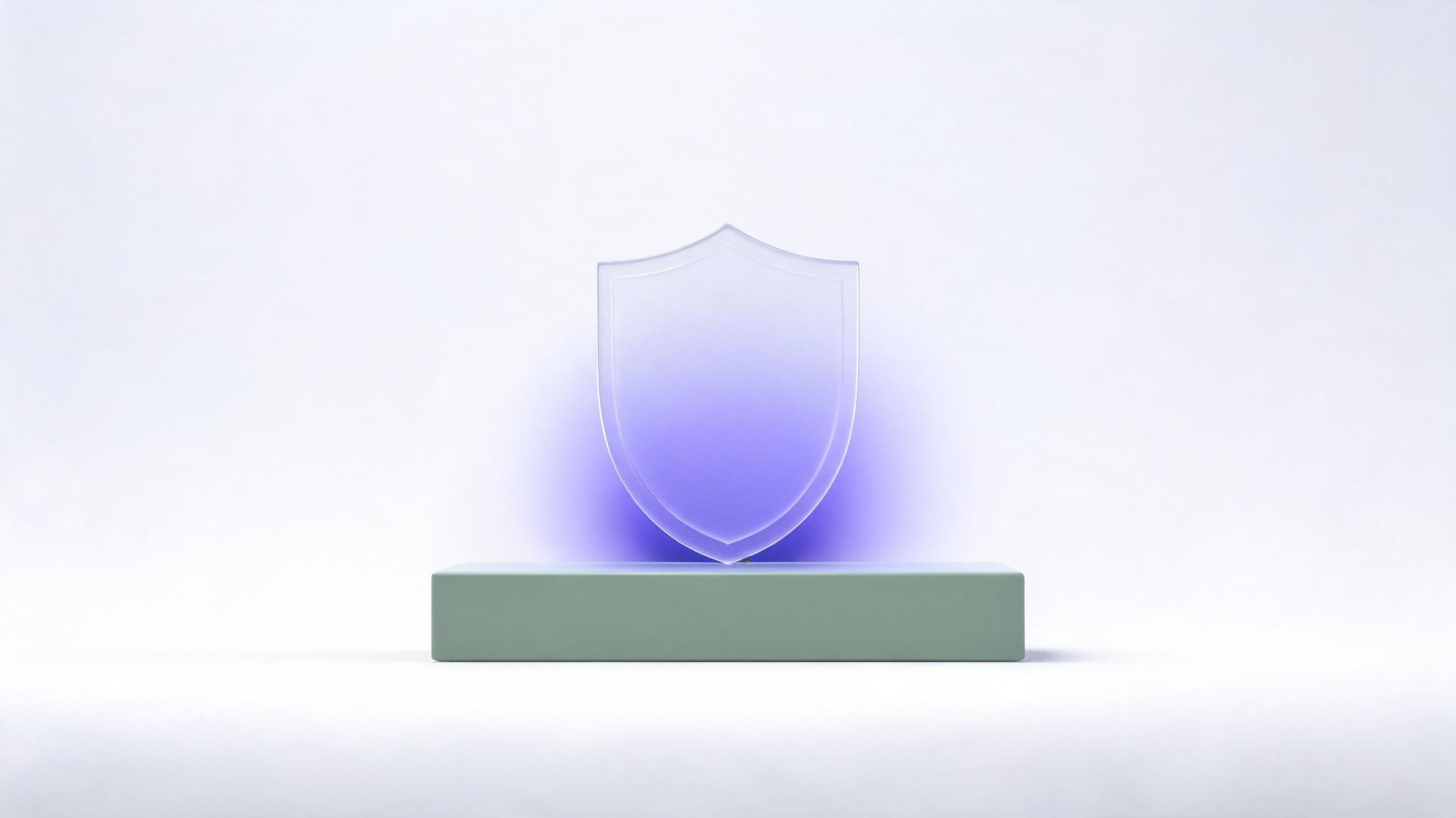 Frosted glass shield on a sage plinth, a symbol of the protection website maintenance NZ businesses rely on